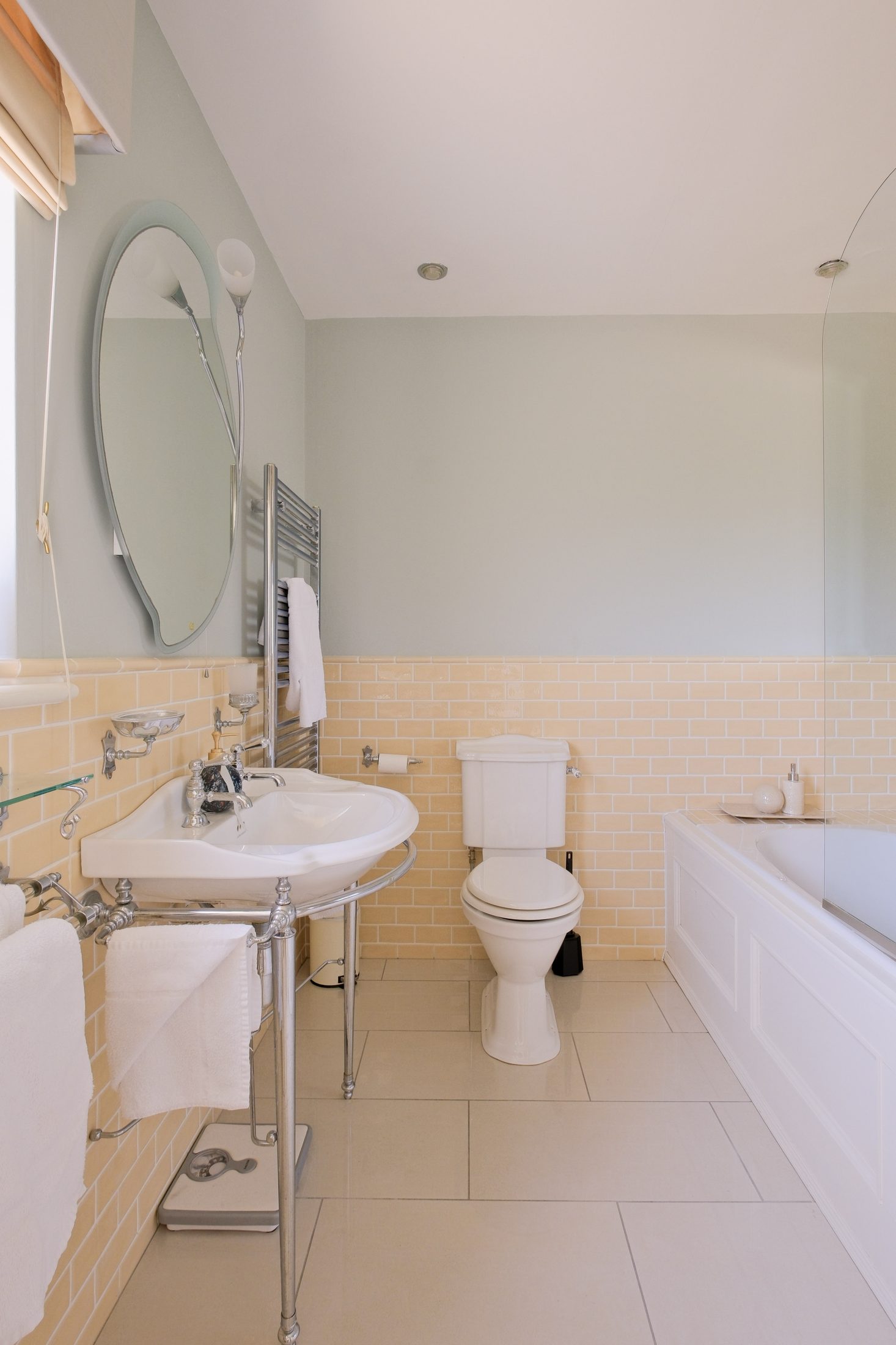 Ensuite bathroom with bath, shower, and soft sage tiling