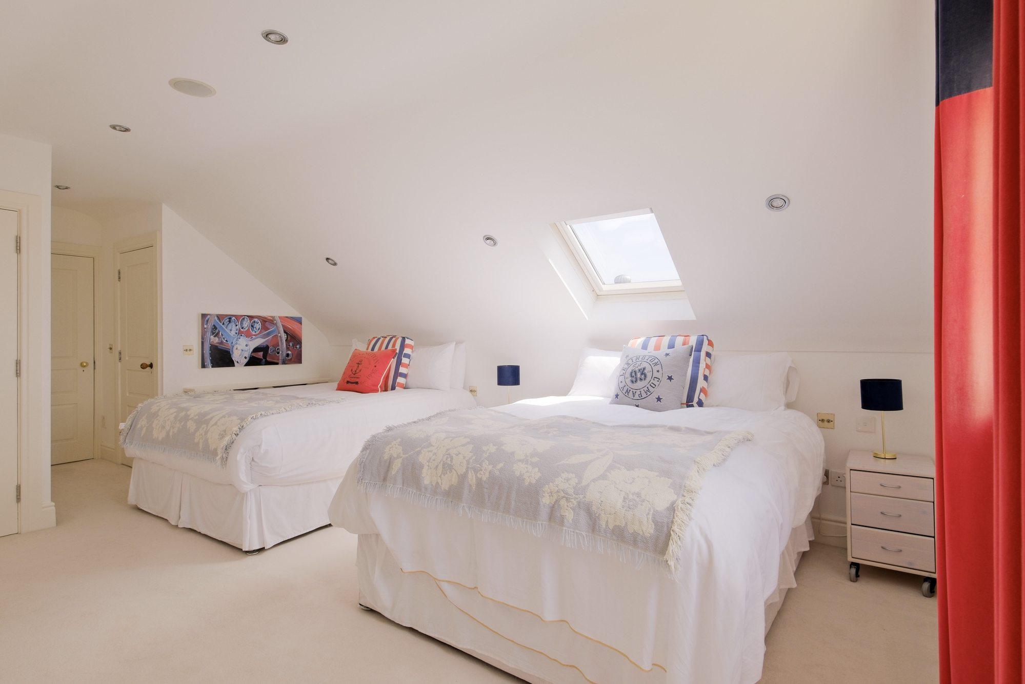 Bedroom 4 with two king beds and motorsport-themed decor