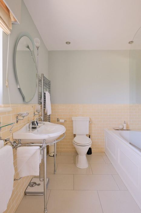 Ensuite bathroom with bath and shower