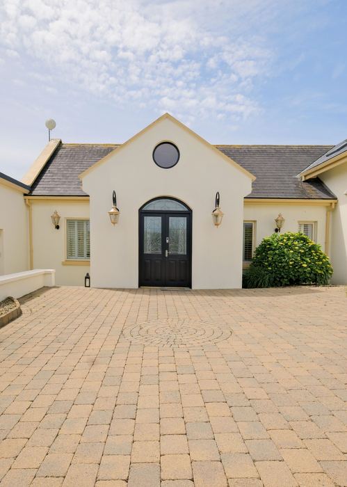 The courtyard entrance to Howard's Way, with double black doors
