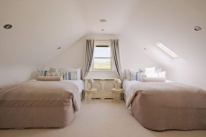 Bedroom 3 with two king beds and dormer skylight